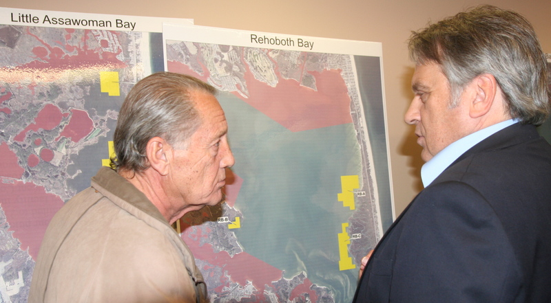 David Saveikis, right, director of the Division of Fish & Wildlife, talks to Dan Wien, Rehoboth Bay area homeowner, about Wien's concerns the Inland Bays are not large enough to accommodate recreational boaters and commercial aquaculture. Saveikis said the state has looked closely at bay uses and talked to a cross section of users. "Aquaculture is going to happen," Savekis said.